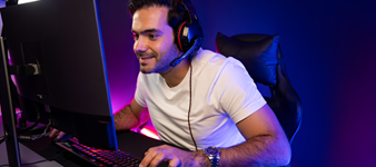 Guy gaming and enjoying Quantum Fiber speeds