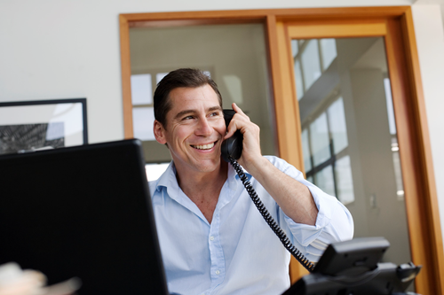 Man on the phone while working from home
