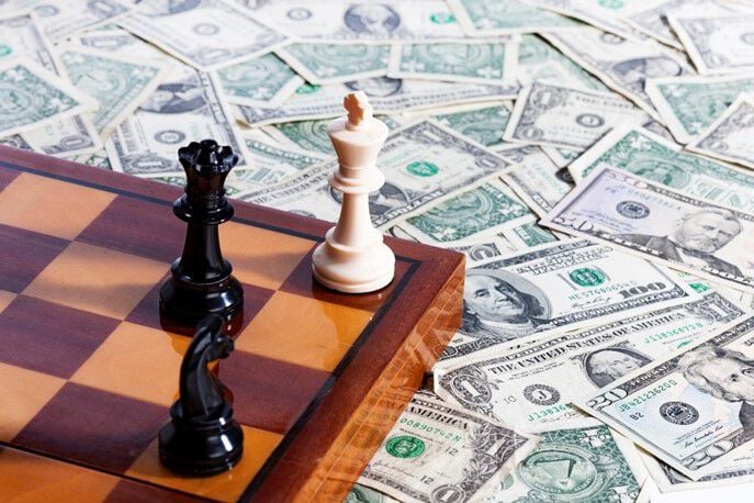 chess game and dollar bills