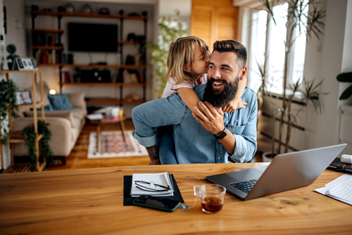 Daughter visiting dad while he works Daughter visiting dad while he works